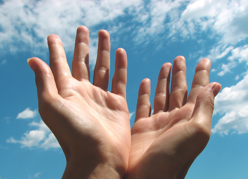 Praying hands by the sky Praying hands by the sky